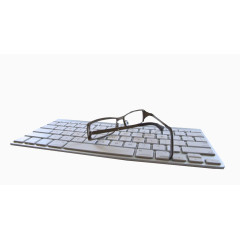 键盘上的眼镜图片