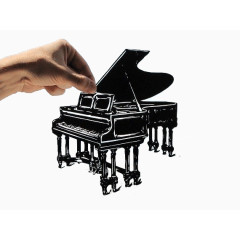 手中的钢琴创意剪纸艺术